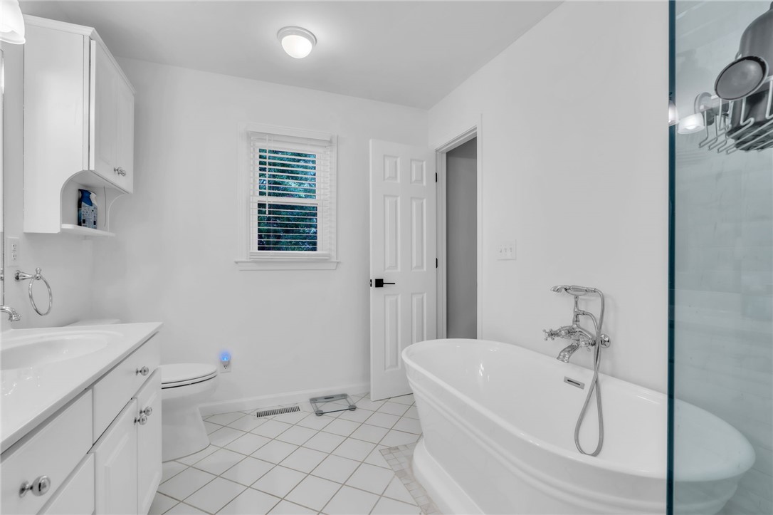 400 Arcadia Drive Anderson, SC 29621 - Photo 21 of 43 This bright bathroom features a spacious tub and sleek vanity for a refreshing daily routine.