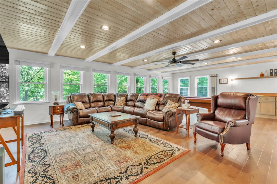 400 Arcadia Drive Anderson, SC 29621 - Photo 3 of 43 This inviting living space features warm wood flooring and large windows, creating a bright and airy atmosphere.