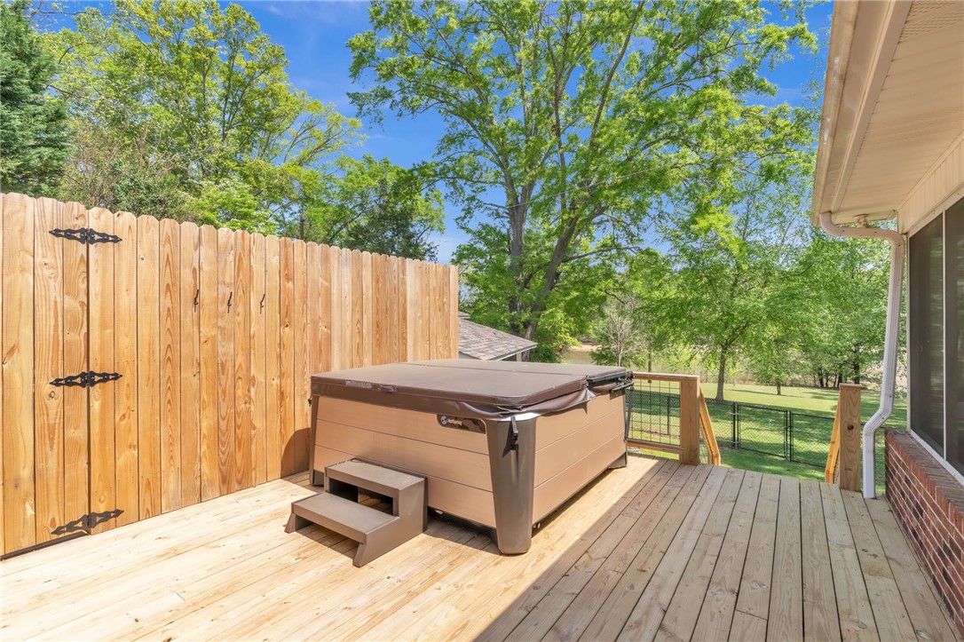 400 Arcadia Drive Anderson, SC 29621 - Photo 31 of 43 This spacious wooden deck features a private hot tub, perfect for relaxation and enjoying the outdoors.