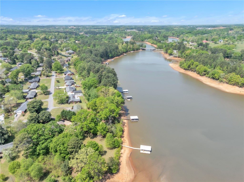 400 Arcadia Drive Anderson, SC 29621 - Photo 40 of 43 This aerial view showcases a vibrant community nestled along a picturesque lake, complete with boat docks.