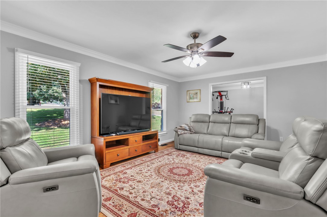 400 Arcadia Drive Anderson, SC 29621 - Photo 5 of 43 This living area features a clean aesthetic, ideal for quiet evenings or lively gatherings.