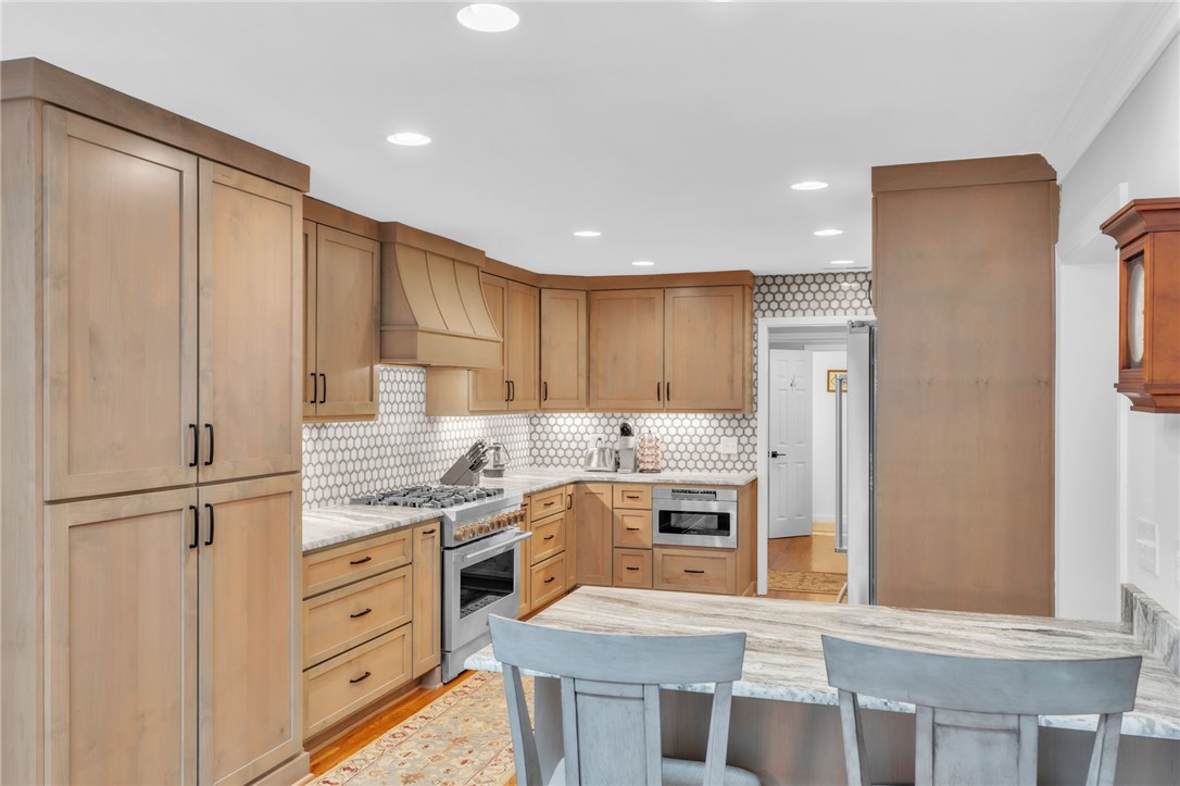 400 Arcadia Drive Anderson, SC 29621 - Photo 6 of 43 This bright kitchen features custom cabinetry and modern appliances, perfect for culinary endeavors.