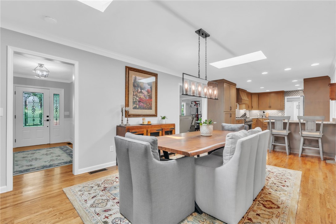400 Arcadia Drive Anderson, SC 29621 - Photo 8 of 43 This bright interior features elegant wood flooring, providing a warm and inviting atmosphere.