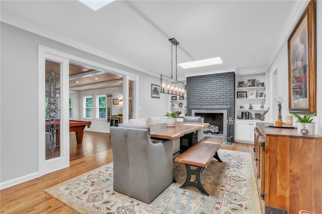 400 Arcadia Drive Anderson, SC 29621 - Photo 9 of 43 This inviting dining area features hardwood flooring and a charming fireplace.
