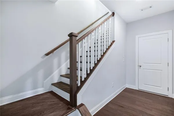 a view of entryway with wooden floor