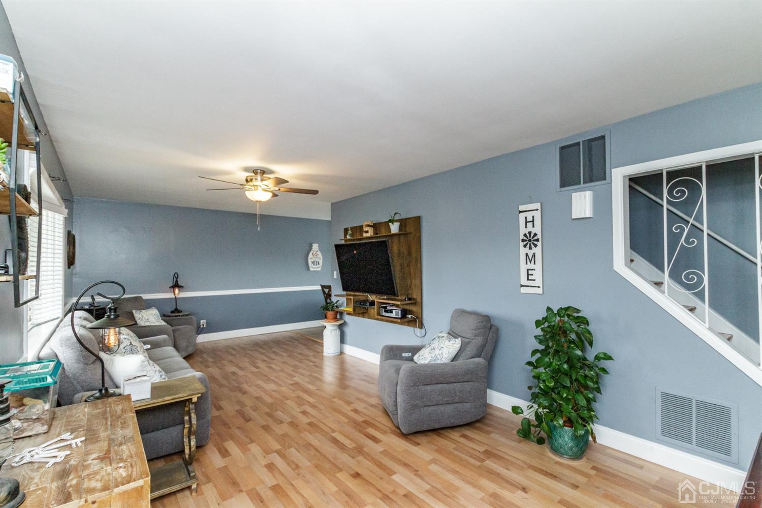 13 Argonne Avenue Hamilton, NJ 08620 - Photo 2 of 24 a living room with furniture and a flat screen tv