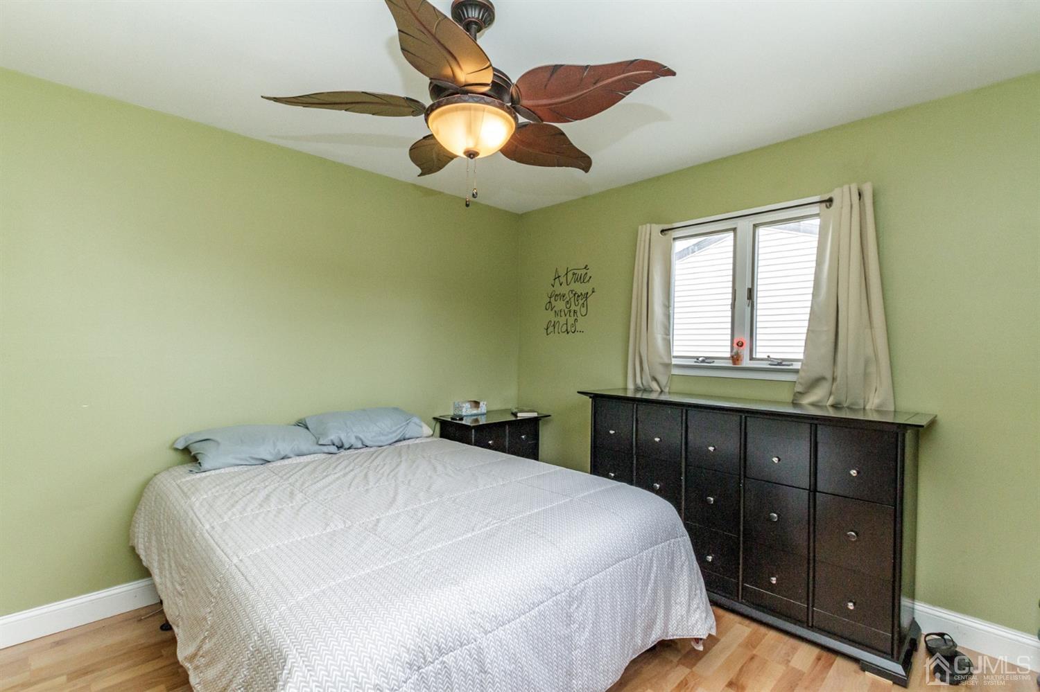 13 Argonne Avenue Hamilton, NJ 08620 - Photo 12 of 24 a bedroom with a bed and a chandelier
