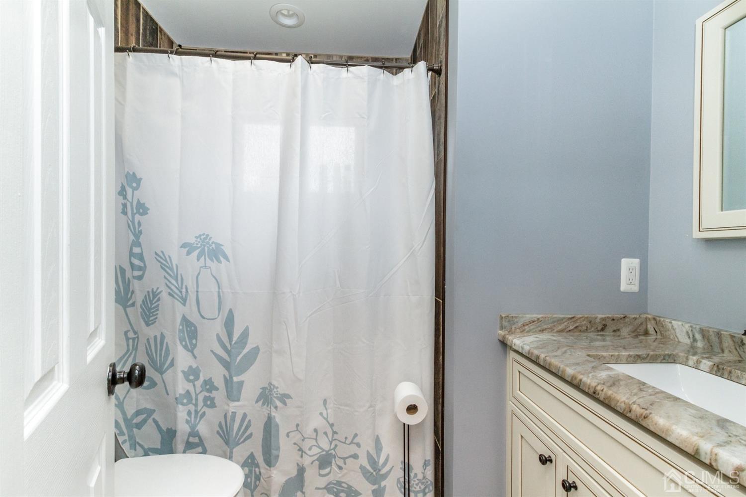 13 Argonne Avenue Hamilton, NJ 08620 - Photo 14 of 24 a bathroom with a granite countertop sink and a mirror
