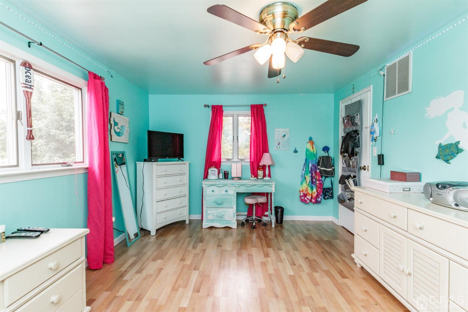 13 Argonne Avenue Hamilton, NJ 08620 - Photo 16 of 24 a room with furniture and a flat screen tv