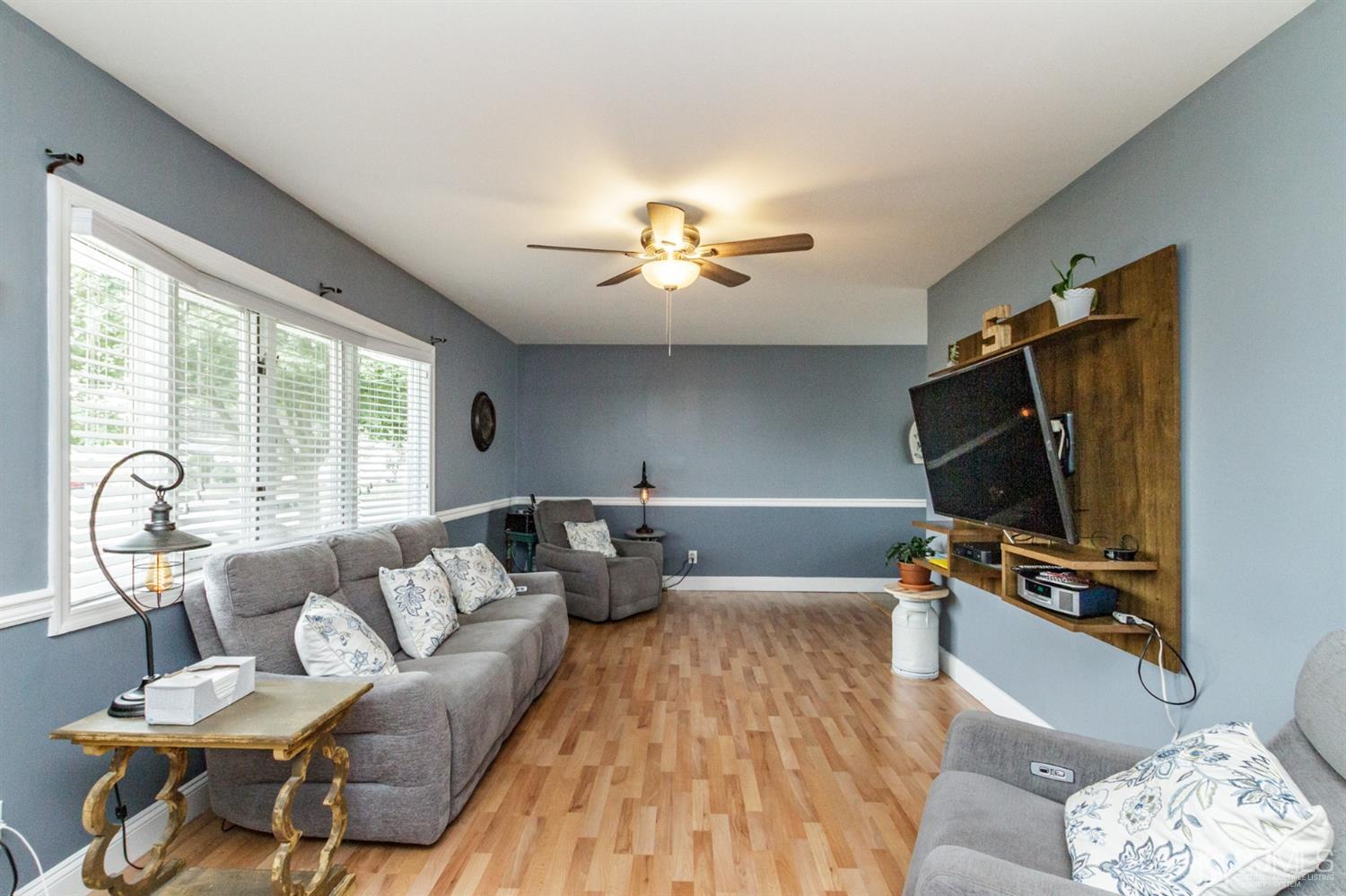 13 Argonne Avenue Hamilton, NJ 08620 - Photo 3 of 24 a living room with furniture and a flat screen tv