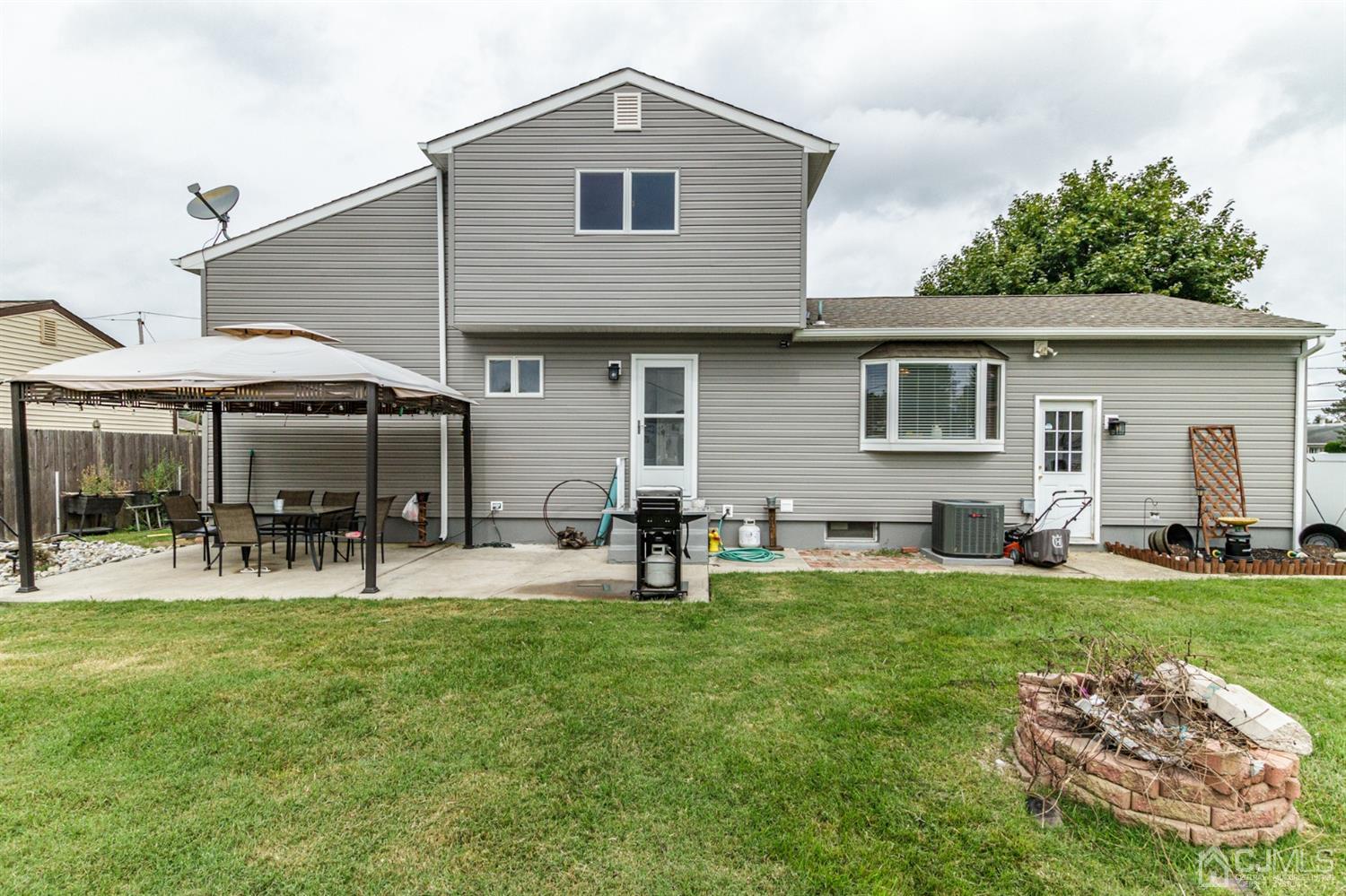 13 Argonne Avenue Hamilton, NJ 08620 - Photo 22 of 24 a backyard of a house with yard fire pit and outdoor seating