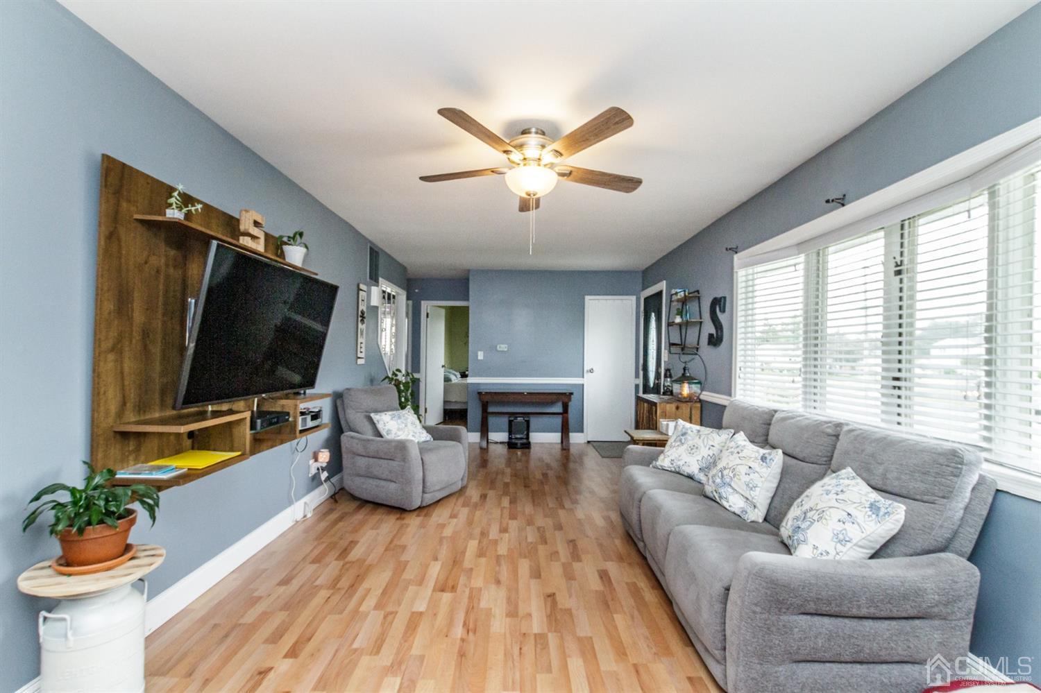 13 Argonne Avenue Hamilton, NJ 08620 - Photo 4 of 24 a living room with furniture and a flat screen tv