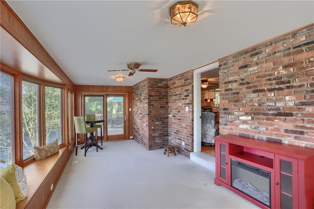 8381 Post Road Allison Park, PA 15101 - Photo 11 of 25 Step into the sunken four seasons room to find luminous windows, including a bright bay window and private access to the rear deck and front porch.