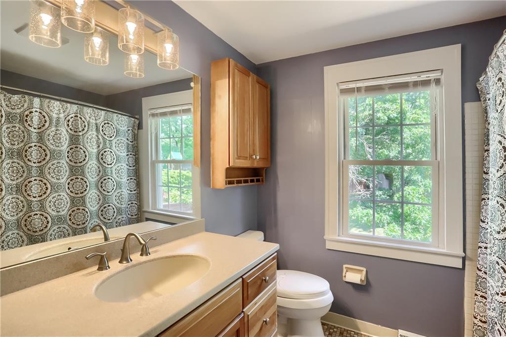8381 Post Road Allison Park, PA 15101 - Photo 18 of 25 Three guest bedrooms share a hall bath boasting an oversized vanity with stylish lighting and a tub/shower combo.