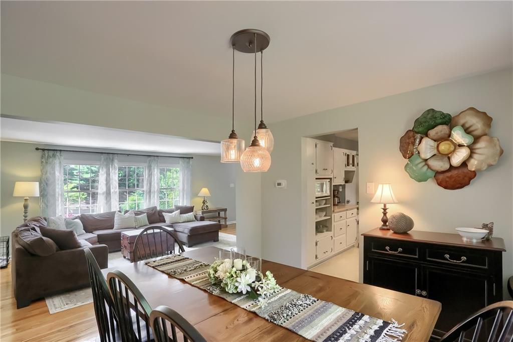 8381 Post Road Allison Park, PA 15101 - Photo 5 of 25 Continue to the dining room to find hardwood flooring, stylish pendant lights, bright windows providing serene views of the rear yard and access to the kitchen.