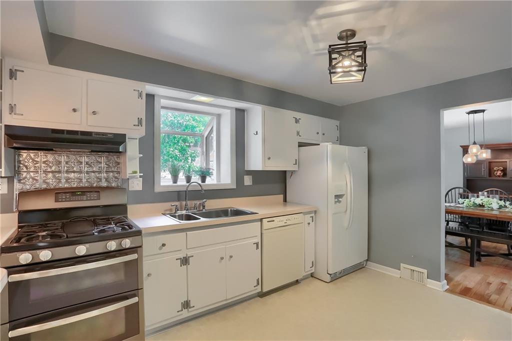 8381 Post Road Allison Park, PA 15101 - Photo 6 of 25 The spacious kitchen boasts abundant white cabinetry.