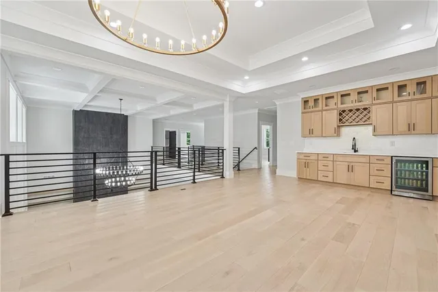 a kitchen with cabinets appliances and a sink