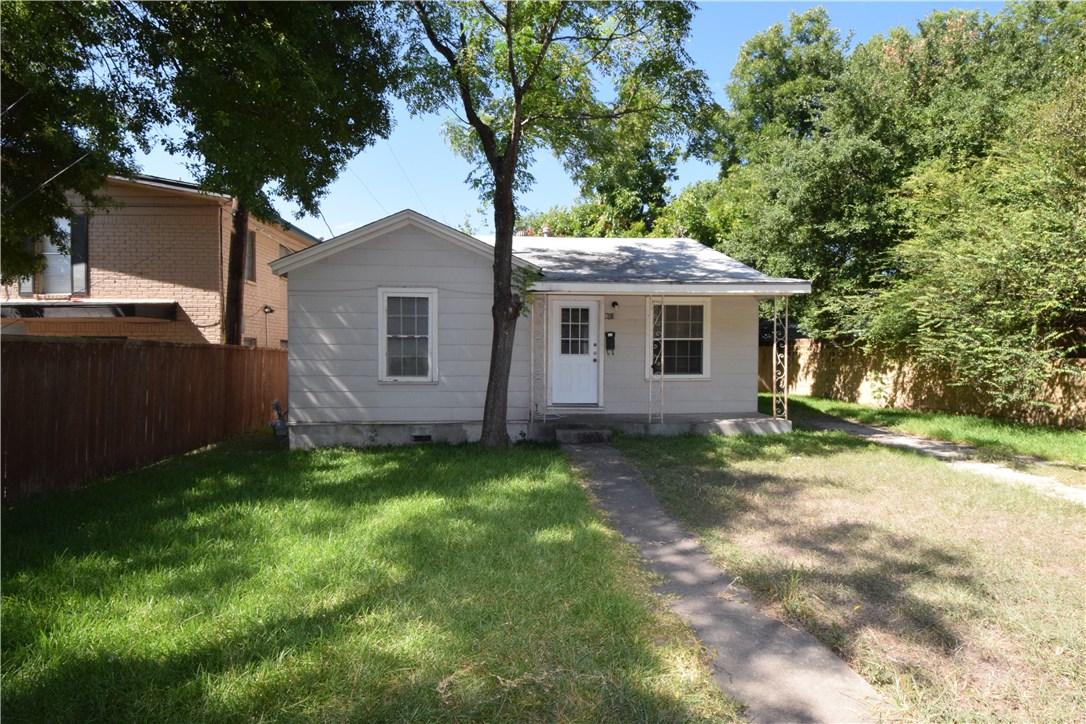 a house with a tree in front of it