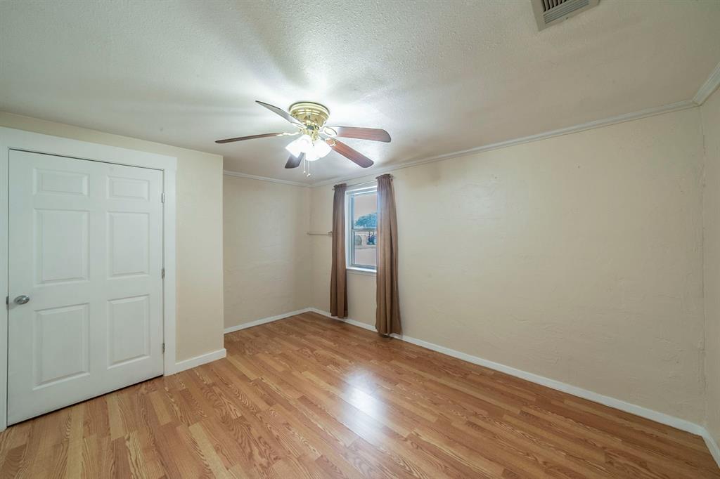 127 County Road 3051 Decatur, TX 76234 - Photo 17 of 35 wooden floor in an empty room with a window