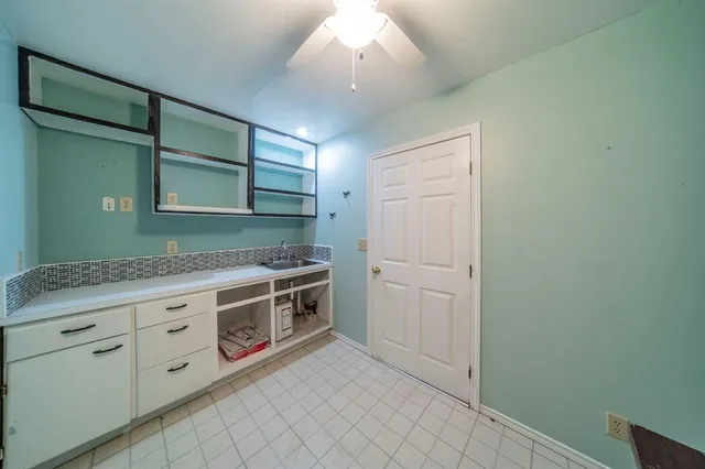 a kitchen with stainless steel appliances granite countertop a stove and a sink