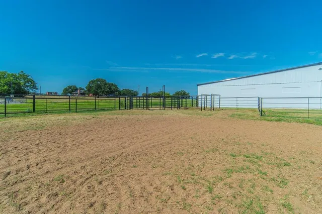 a view of a golf course with a lake view