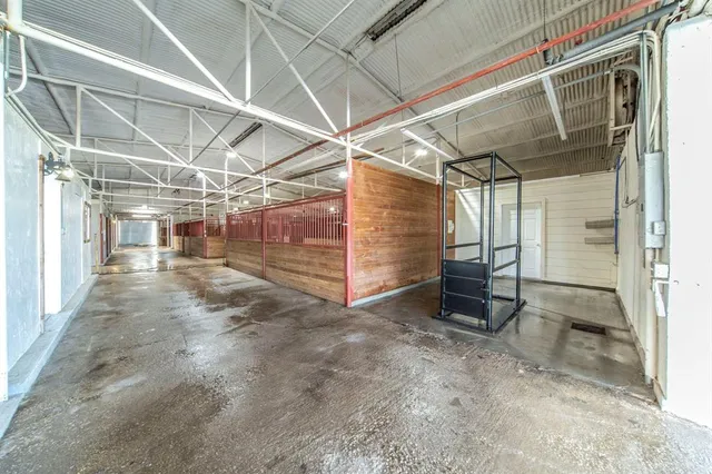 a view of empty room with wooden walls