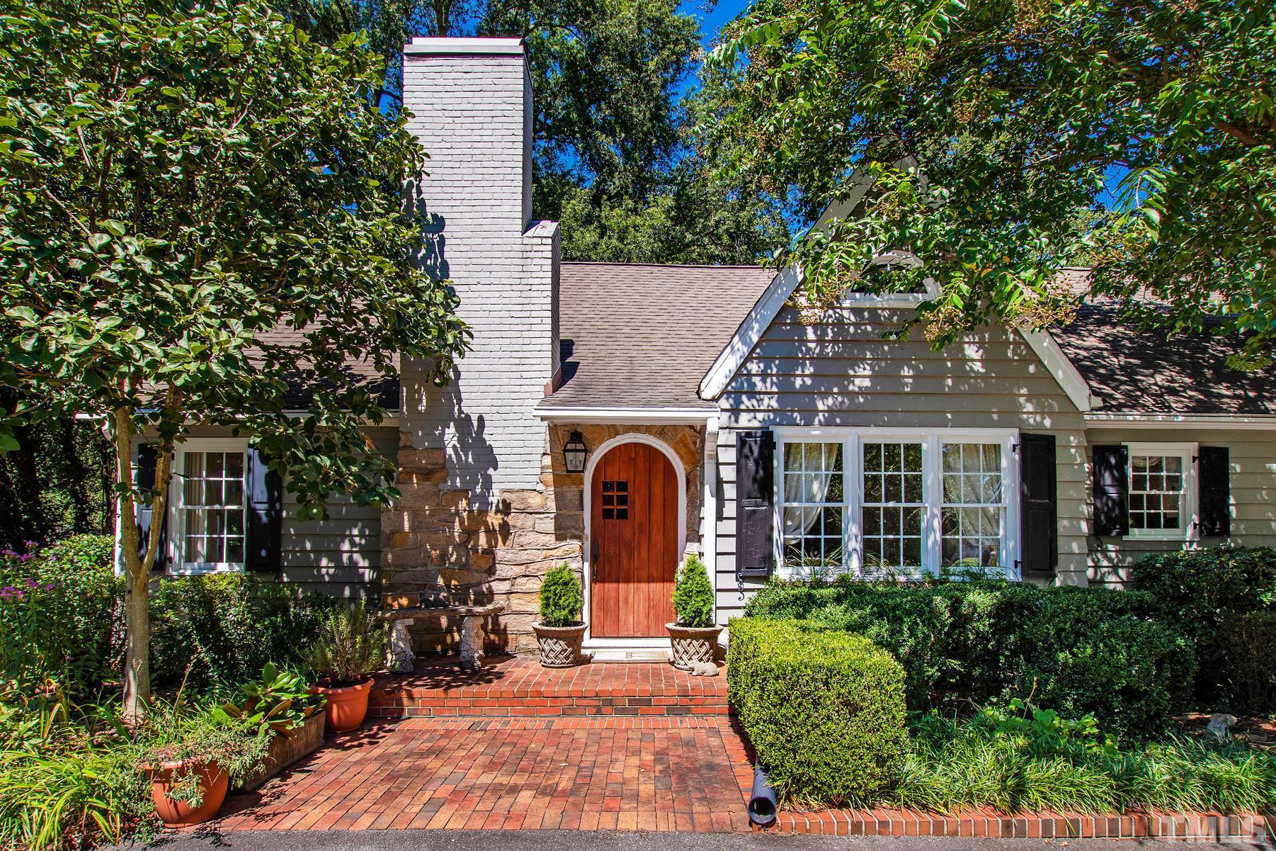 802 Lake Boone Trail Raleigh, NC 27607 - Photo 1 of 30 a front view of a house with garden