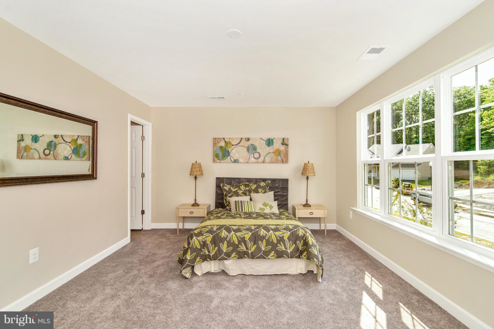 11 Cassidy Court Point of Rocks, MD 21777 - Photo 20 of 30 a bed sitting in a spacious bedroom next to a window
