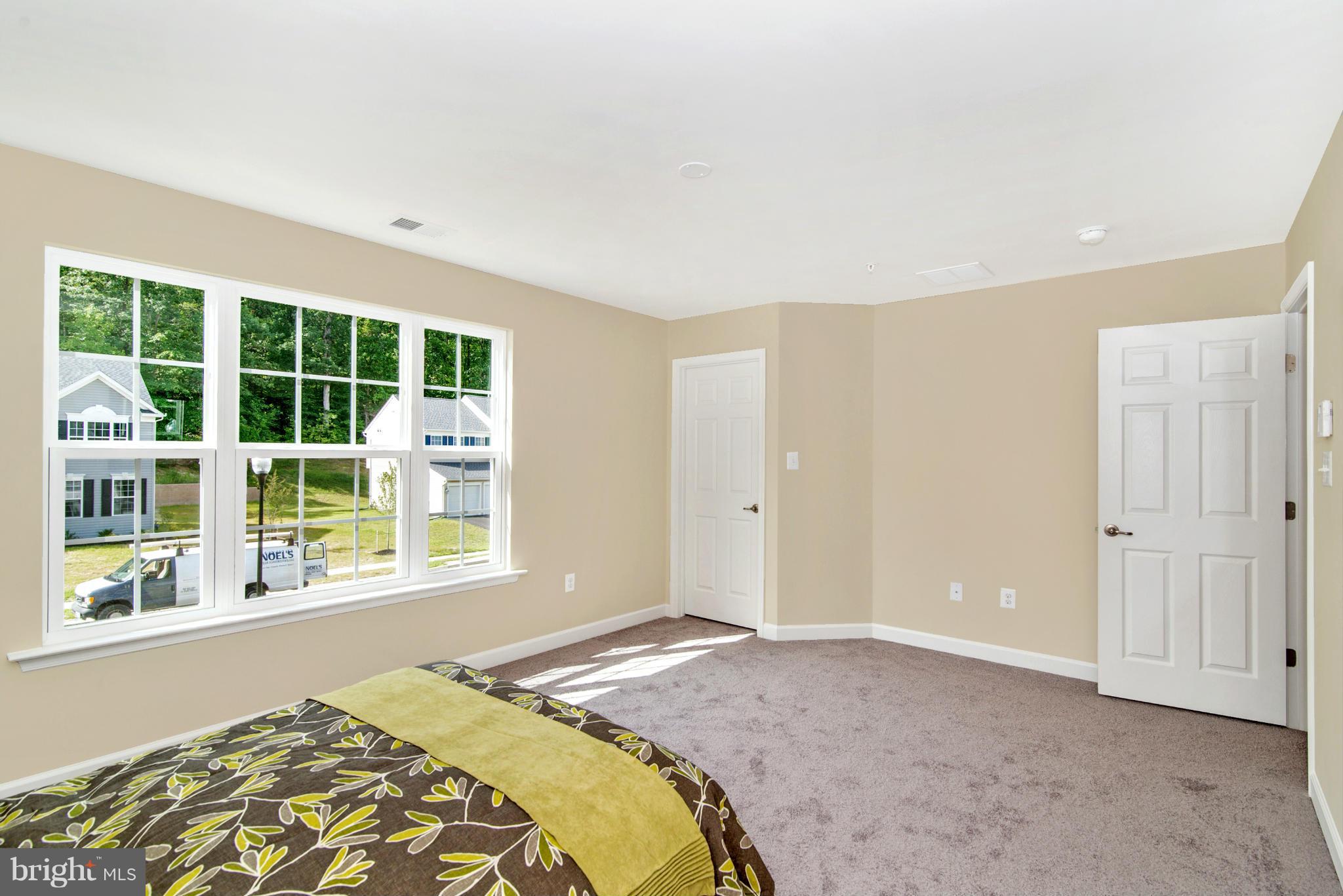 11 Cassidy Court Point of Rocks, MD 21777 - Photo 21 of 30 a bedroom with a bed and a large window