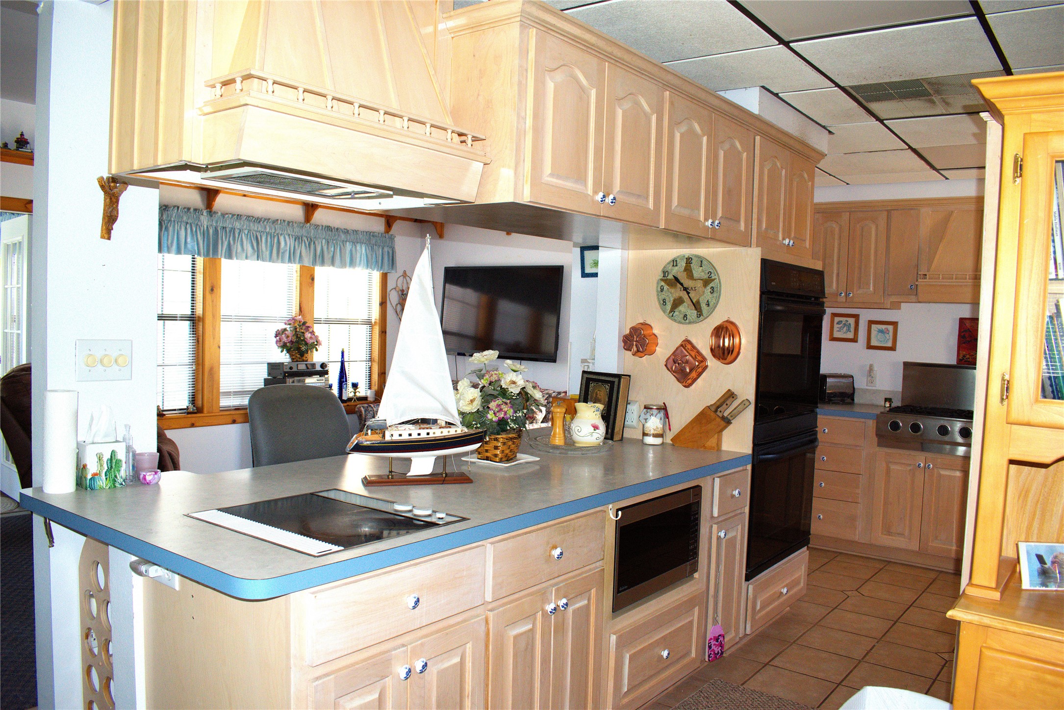 1657 County Road Sargent, TX 77414 - Photo 32 of 46 a kitchen with stainless steel appliances granite countertop a sink and a cabinets