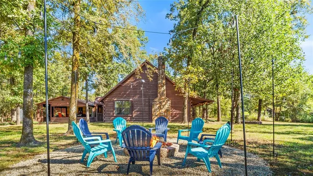 a view of chairs and table in the patio