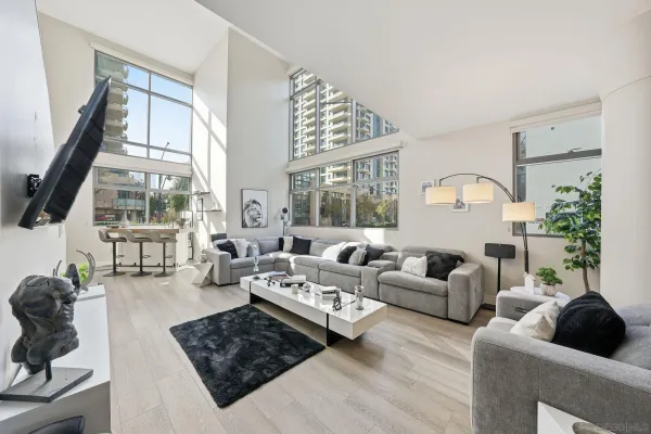 a living room with furniture and a large window
