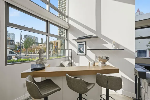 a dining room with furniture and window