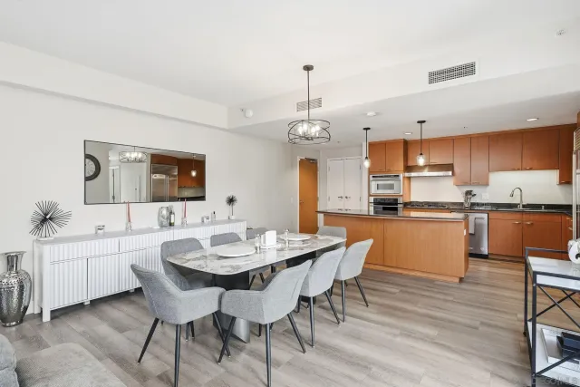 a view of a dining room with furniture and wooden floor