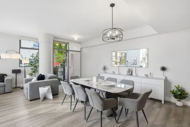 a view of a dining room with furniture window and wooden floor