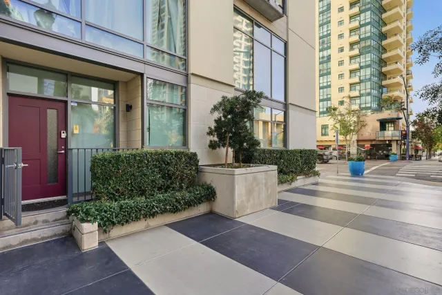 a view of a building with potted plants