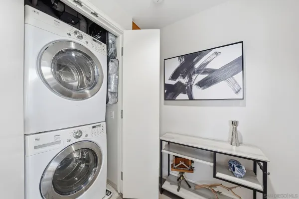 a view of a hallway with washer and dryer