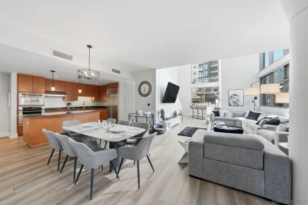 a view of a dining room with furniture and wooden floor