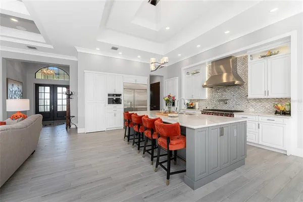 a kitchen with stainless steel appliances granite countertop a sink and stove