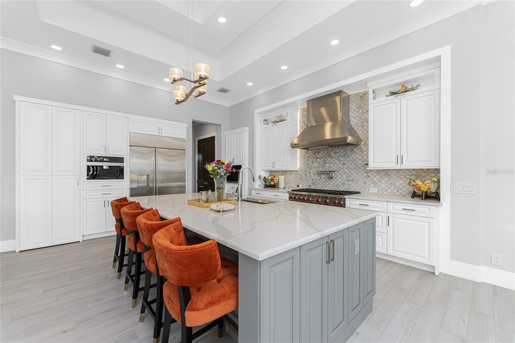 265 Severin Road Southeast Port Charlotte, FL 33952 - Photo 15 of 88 a view of kitchen with stainless steel appliances granite countertop a stove a sink a dining table and chairs