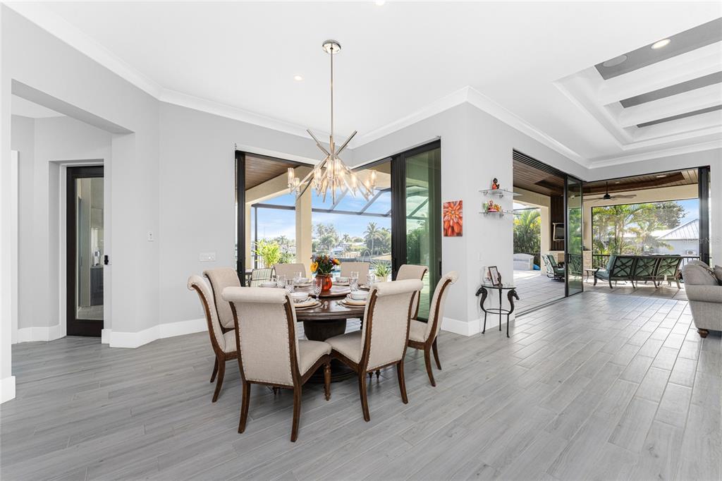 265 Severin Road Southeast Port Charlotte, FL 33952 - Photo 21 of 88 a view of a dining room with furniture window and wooden floor