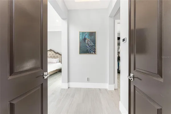 a view of a livingroom with furniture hardwood floor and a window