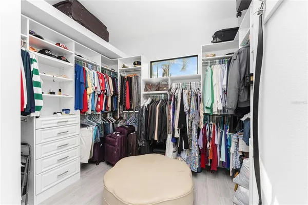 a kitchen with a stove a refrigerator and a dining table