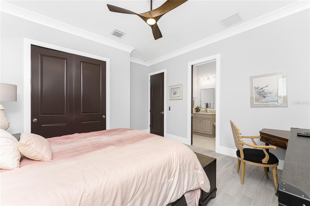 265 Severin Road Southeast Port Charlotte, FL 33952 - Photo 47 of 88 a bedroom with a bed and a desk