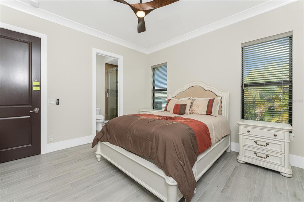 265 Severin Road Southeast Port Charlotte, FL 33952 - Photo 51 of 88 a bedroom with a bed and a tv