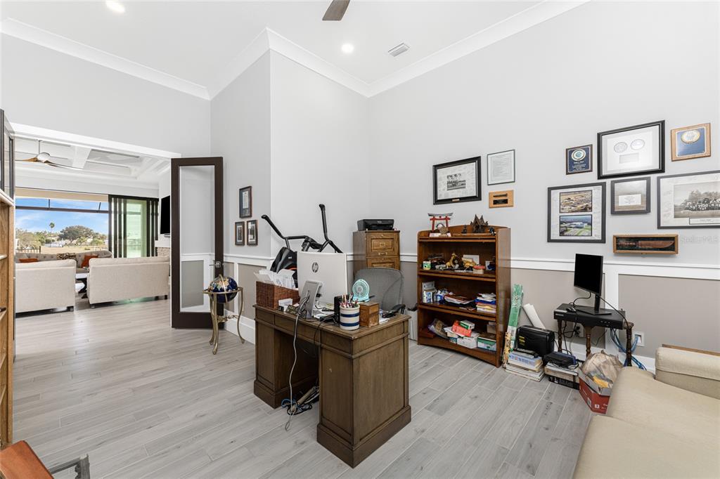 265 Severin Road Southeast Port Charlotte, FL 33952 - Photo 57 of 88 a living room with furniture and wooden floor