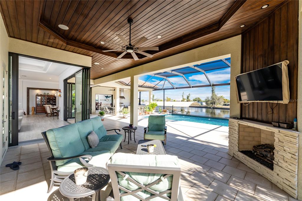 265 Severin Road Southeast Port Charlotte, FL 33952 - Photo 68 of 88 a living room with fireplace furniture and a flat screen tv