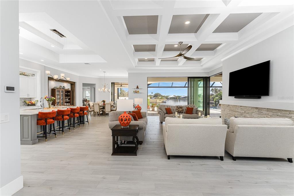 265 Severin Road Southeast Port Charlotte, FL 33952 - Photo 7 of 88 a living room with furniture and a flat screen tv