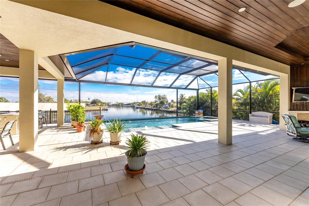 265 Severin Road Southeast Port Charlotte, FL 33952 - Photo 71 of 88 a view of a patio with a table and chairs under an umbrella