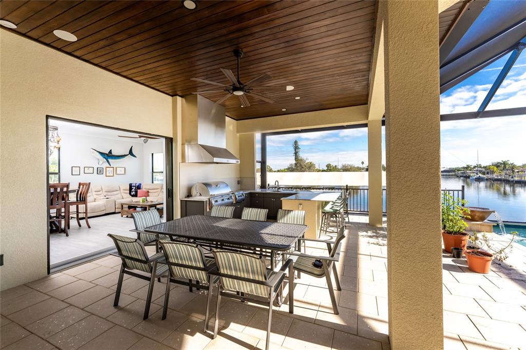 265 Severin Road Southeast Port Charlotte, FL 33952 - Photo 72 of 88 a dining room with furniture and a floor to ceiling window